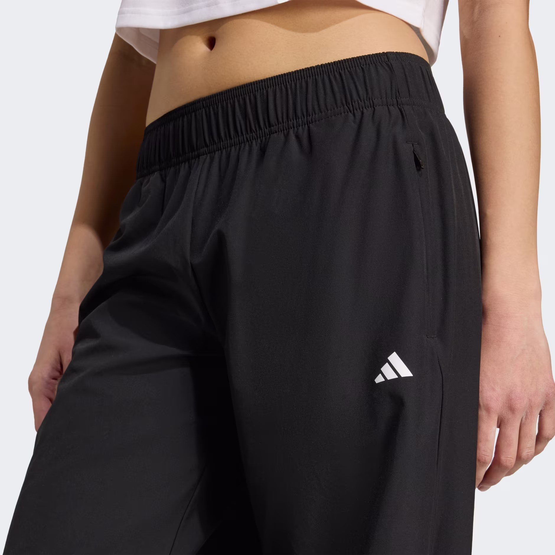 Adidas ქალის შარვალი WE WOVEN PAN