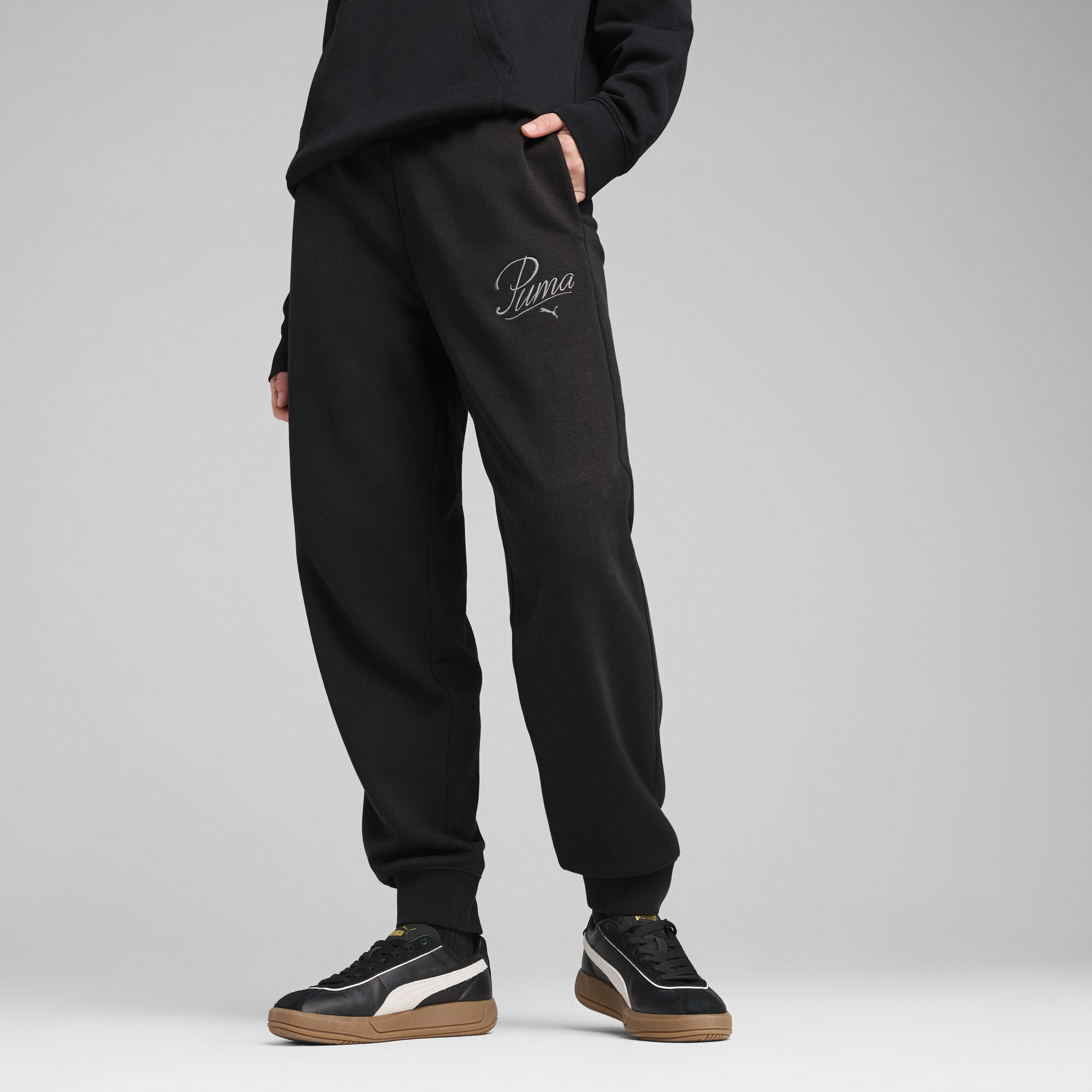 Puma ქალის შარვალი ESS SCRIPT Sweatpants TR cl
