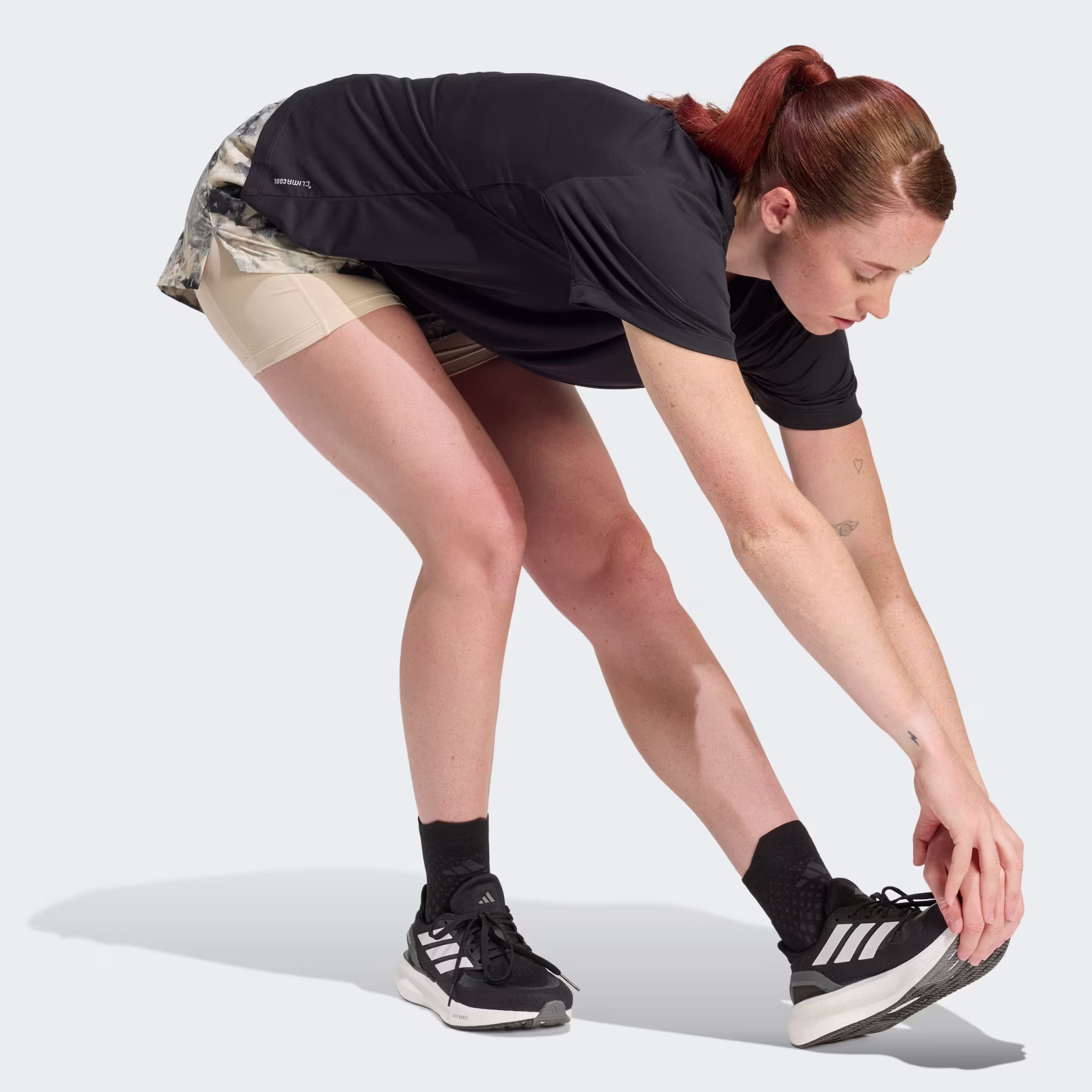 Adidas ქალის მაისური Run Ess Tee W